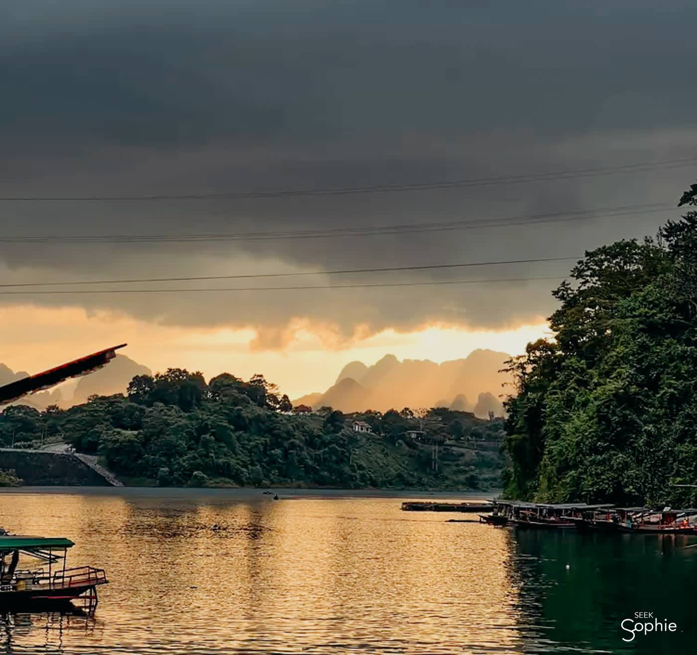 Sunset over the lake behind the floating huts