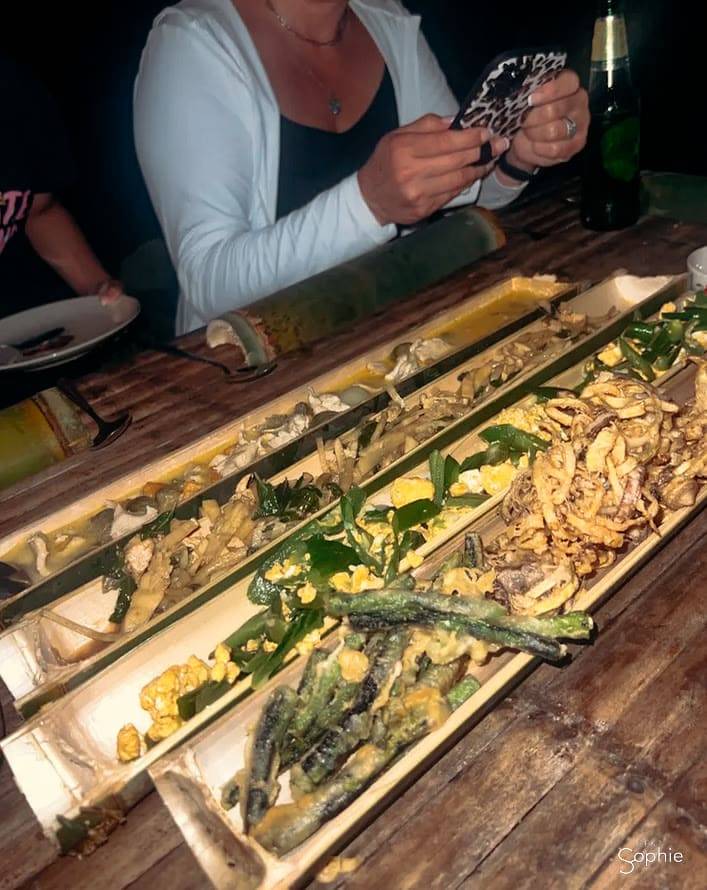 Dishes wrapped in banana leaf above the fire