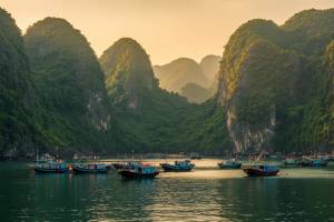 Boats between the limestone cliffs at Cat Ba