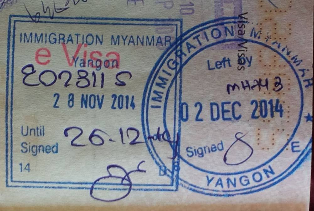 Entry and exit stamps on a passport page