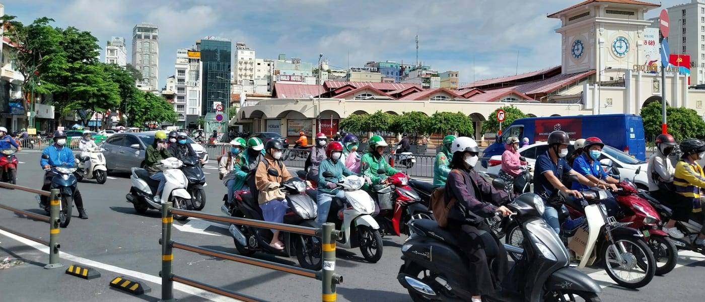 A river of motorbikes on the roundabout at Ben Thanh Market